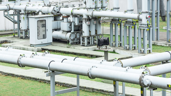 Industrial piping network and control panel at a utility facility
